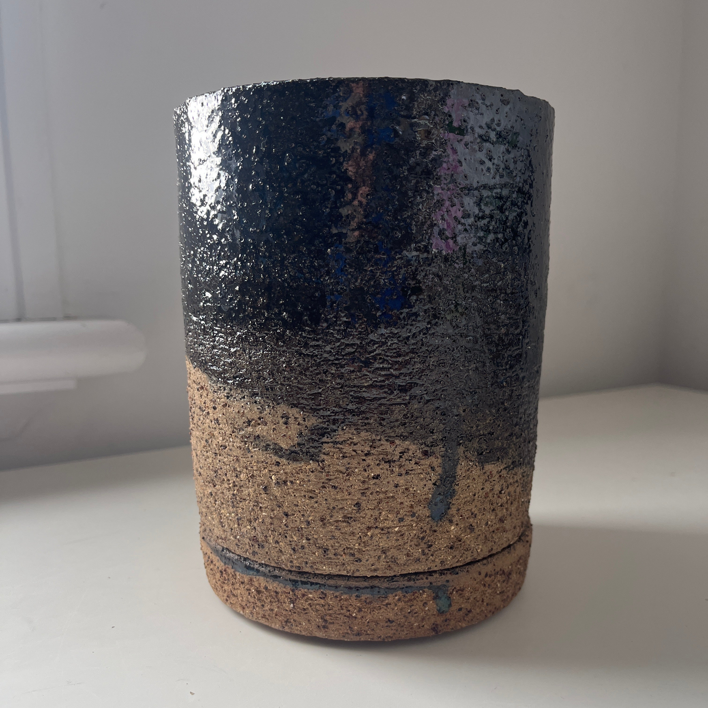 Cylindrical object with textured surface on a white background