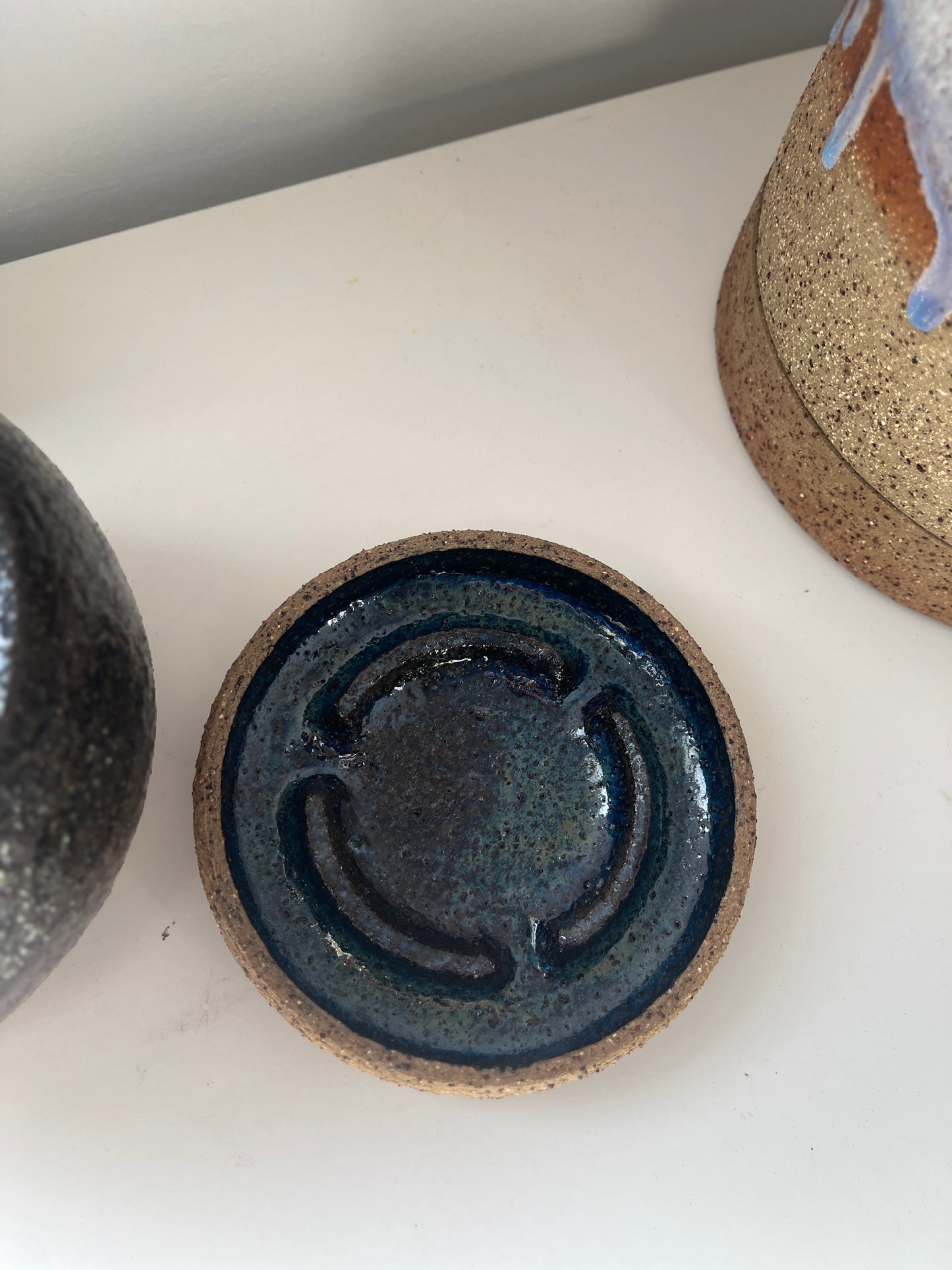 Ceramic dish with a textured surface on a white background