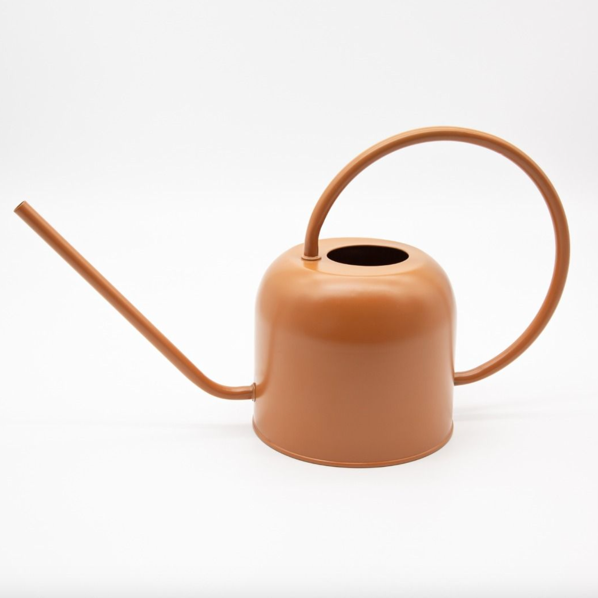 Brown watering can on a white background