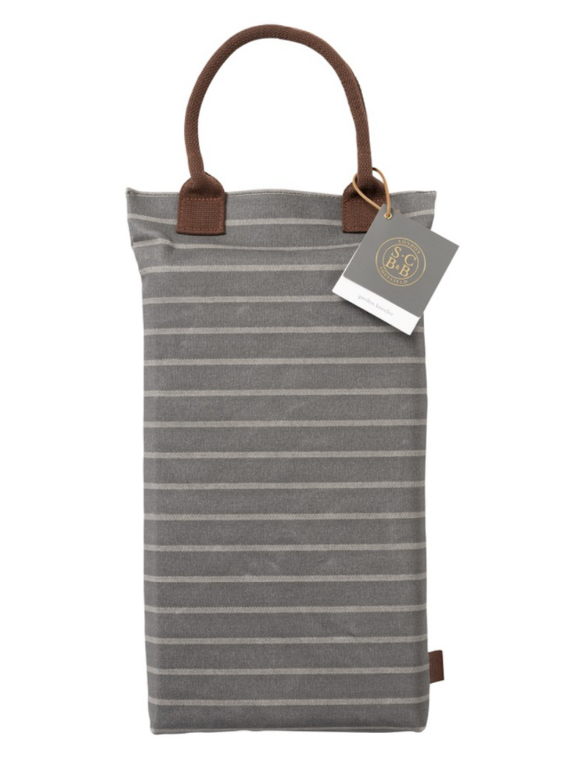 Striped cushion to kneel on in the garden with brown handles and tag on a white background