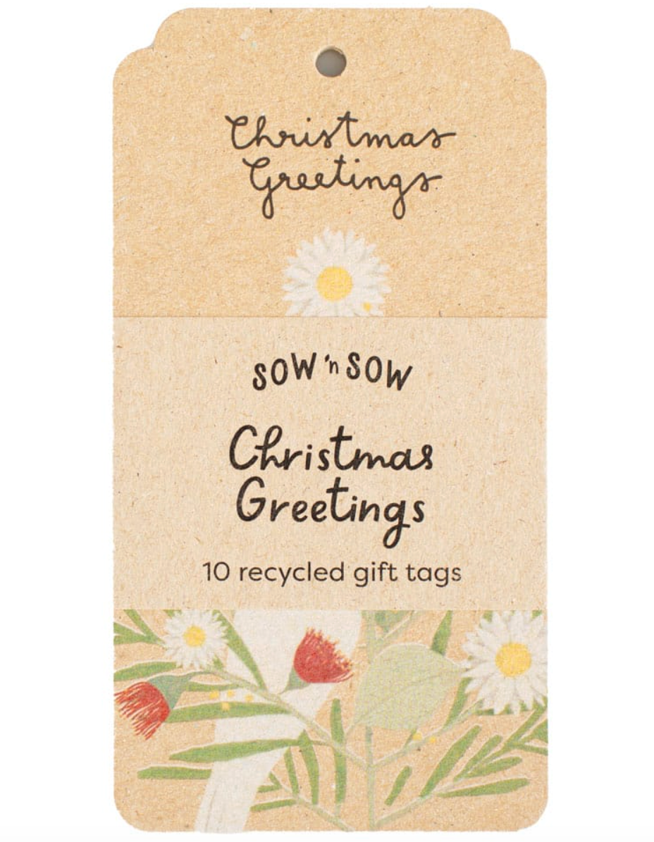 Recycled gift tag with floral design and 'Christmas Greetings' text on a beige background