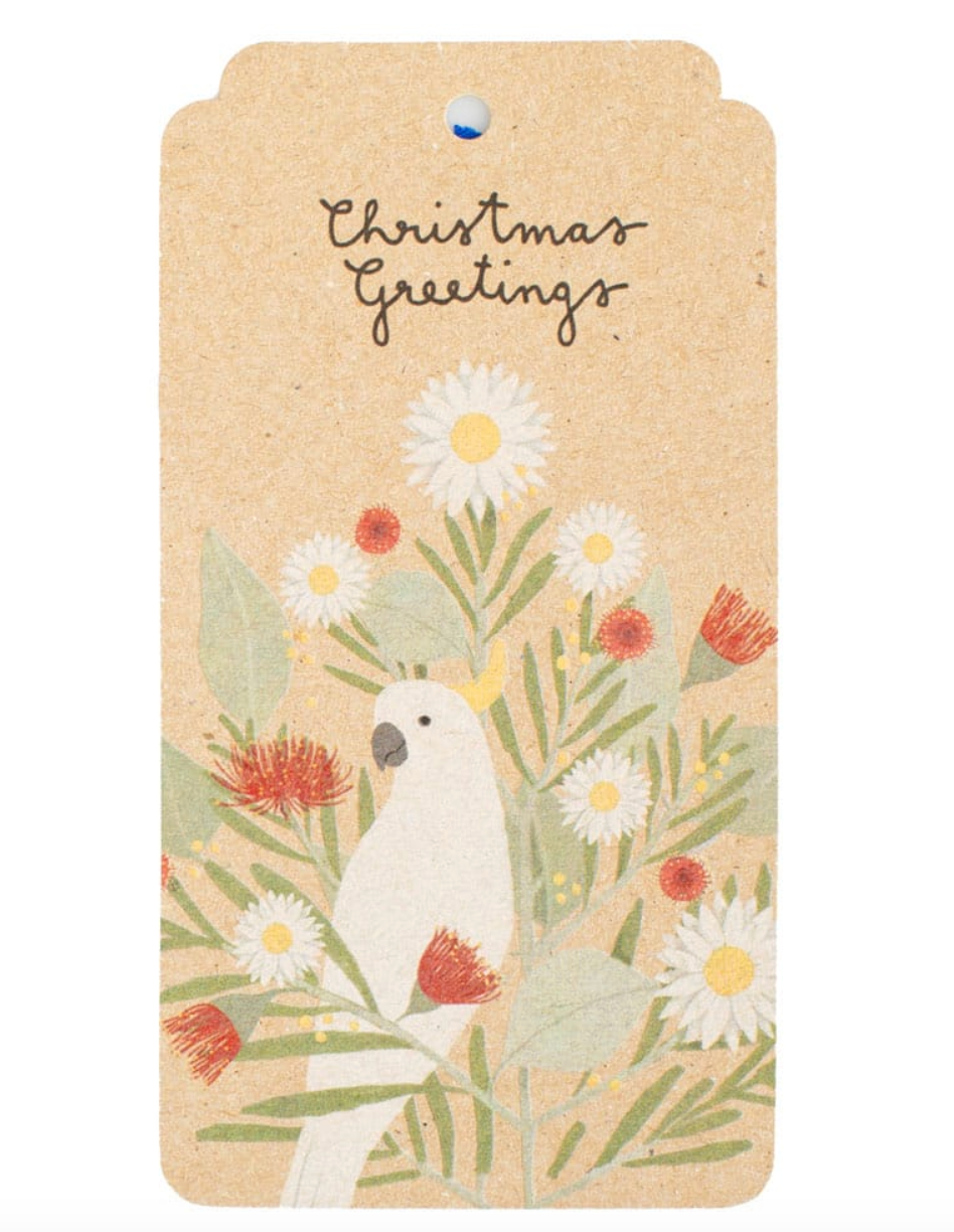 Card with a white bird and floral design on a beige background, featuring the text 'Christmas Greetings'.