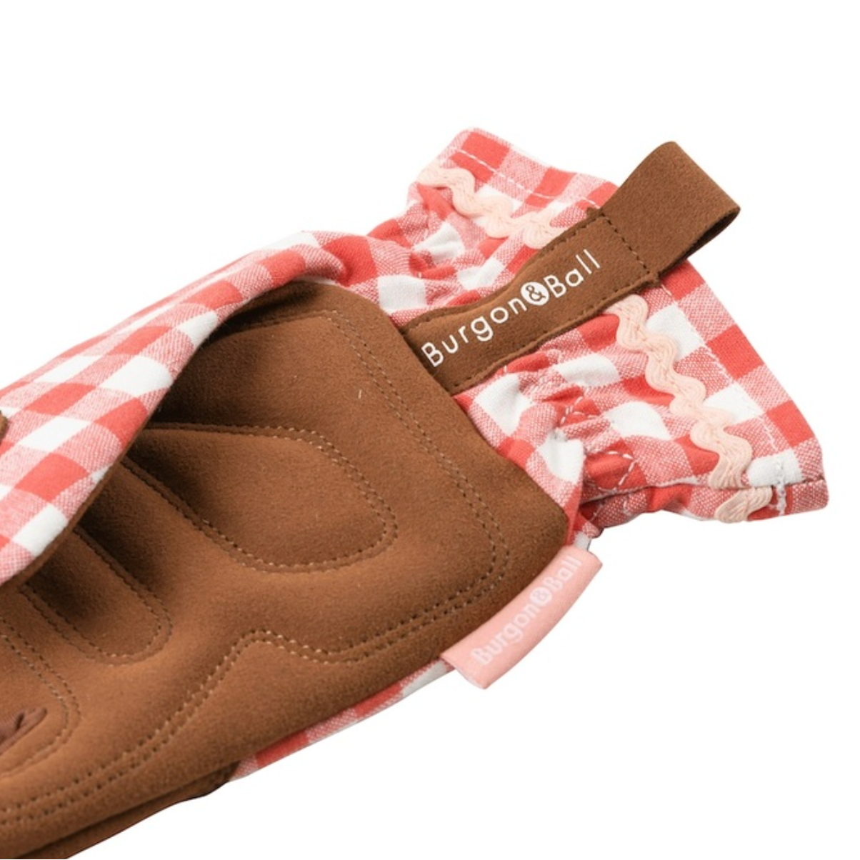 Brown glove with a checkered lining on a white background