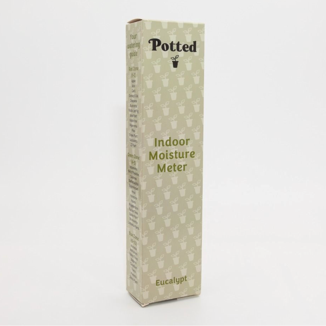 Box of a potted indoor moisture meter on a white background