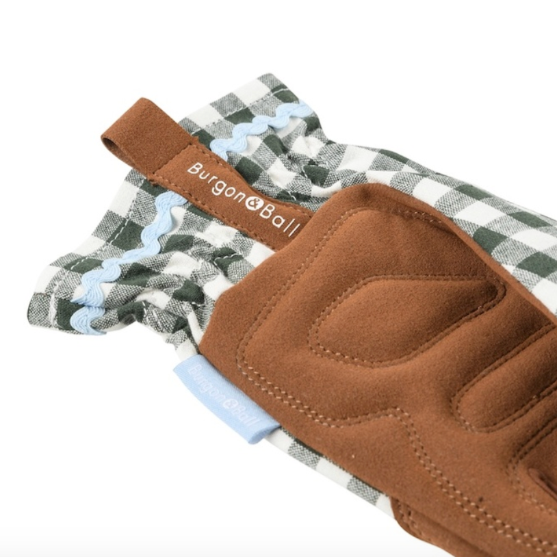 Brown gardening gloves with checkered wristband on a white background