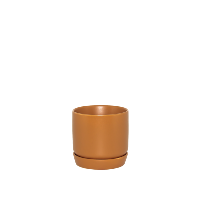 Ceramic planter in a cinnamon color on a white background