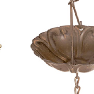 Three hanging metal rain catchers shown against a plain white background, each with three tiers of scalloped bowl sections connected by chains. The left one has a distressed blue-gray finish, the center one has a distressed olive-gold finish, and the right one has a distressed bronze-brown finish.