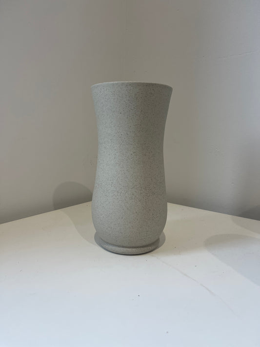 Gray textured cylindrical object on a white background