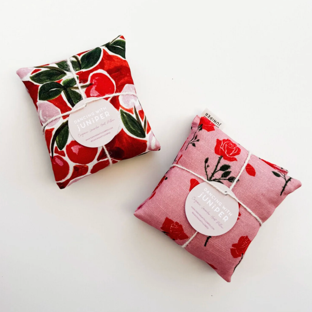 Two fabric sachets with floral patterns on a white background