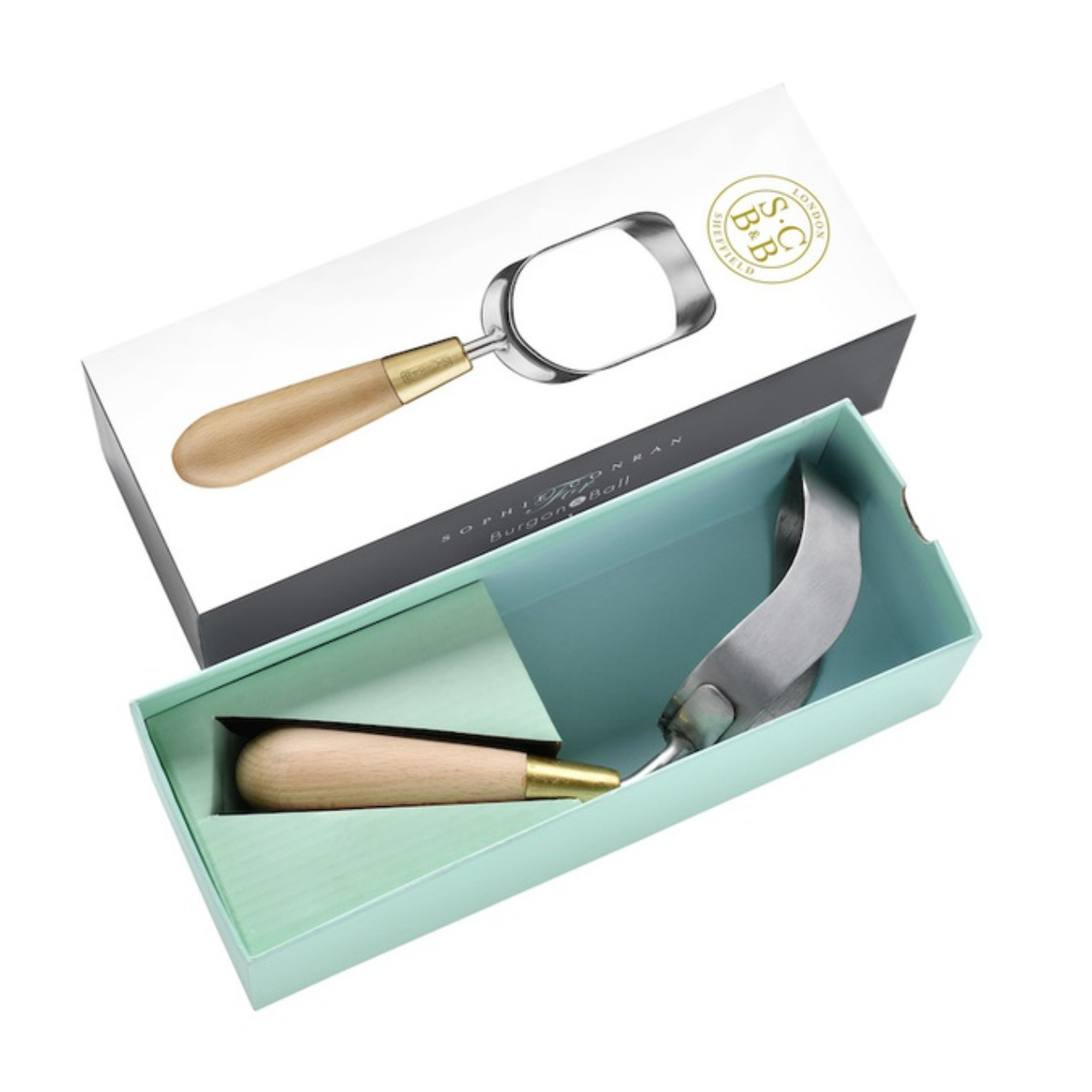 An open mint green presentation box containing a garden hoe tool with a light wood handle and metallic head, shown alongside the branded white lid on a clean white background.
