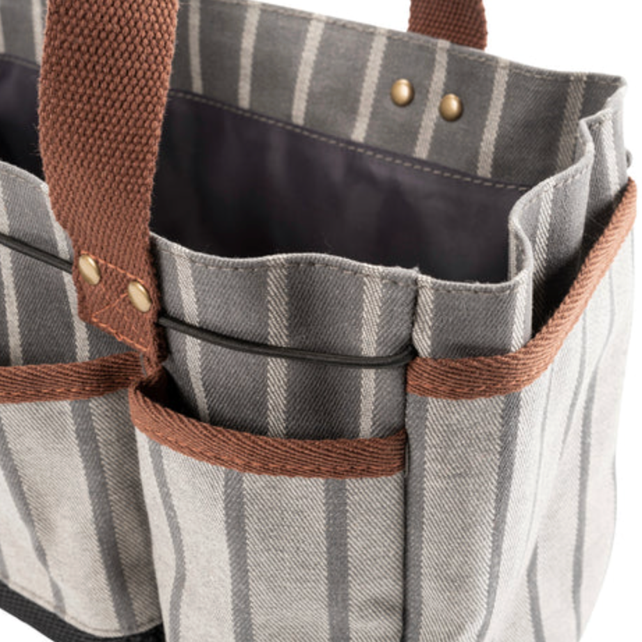 Striped tote bag with brown handles and trim