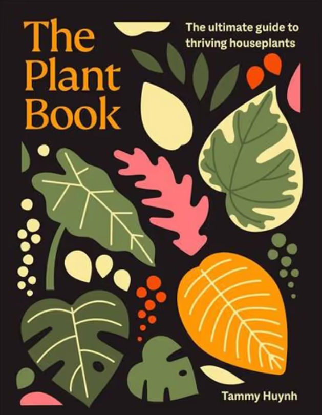 The Plant Book book cover by Tammy Huynh, featuring a black background with colorful, stylized illustrations of houseplant leaves and fruits in green, orange, pink, and cream. The title is written in large orange letters on the left, with the subtitle 'The ultimate guide to thriving houseplants' on the top right.